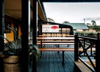 Park DDA Setting, battens in aluminium woodgrain Spotted Gum, frames in Textura Monument.