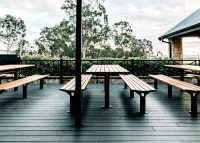 Park DDA Setting, battens in aluminium woodgrain Spotted Gum, frames in Textura Monument.