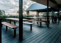 Park DDA Setting, battens in aluminium woodgrain Spotted Gum, frames in Textura Monument.