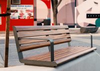 Linea Seat (LIS10, 1500) plinth-fixed with aluminium Spotted Gum battens, Textura Woodland Grey frames.
