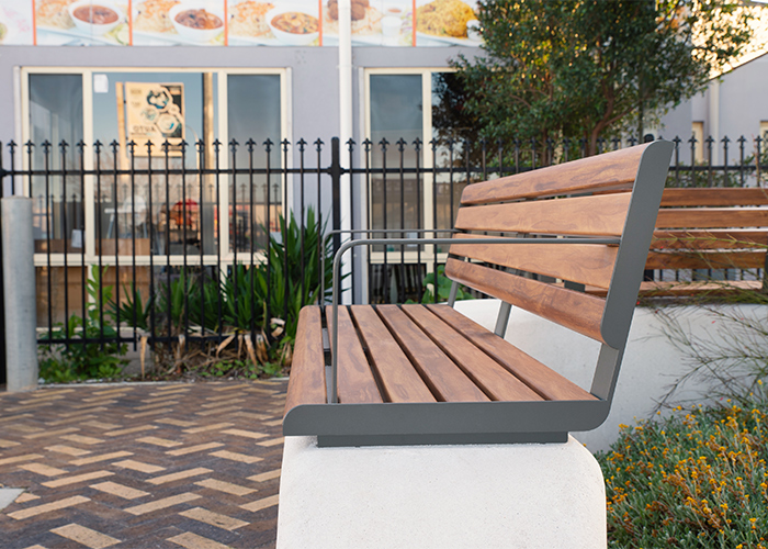 Linea Seat (LIS10, 1500) plinth-fixed with aluminium Spotted Gum battens, Textura Woodland Grey frames.