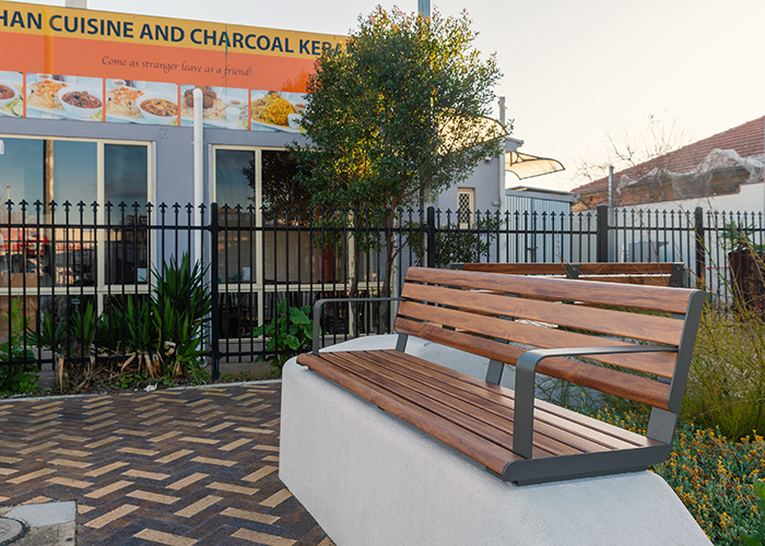 Linea Seat (LIS10, 1500) plinth-fixed with aluminium Spotted Gum battens, Textura Woodland Grey frames.