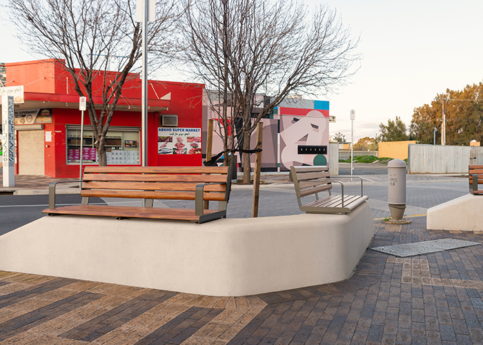 Linea Seat (LIS10, 1500) plinth-fixed with aluminium Spotted Gum battens, Textura Woodland Grey frames.