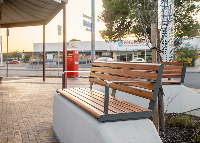 Linea Seat (LIS10, 1500) plinth-fixed with aluminium Spotted Gum battens, Textura Woodland Grey frames.