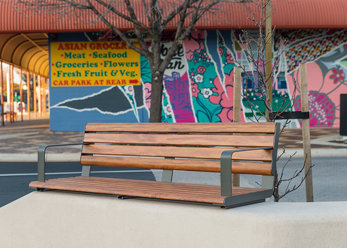 Linea Seat (LIS10, 1500) plinth-fixed with aluminium Spotted Gum battens, Textura Woodland Grey frames.