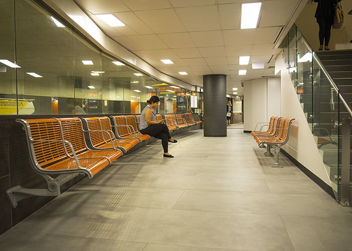 TransLink's bright orange Concourse Seats add warmth and comfort to the refurbished station.