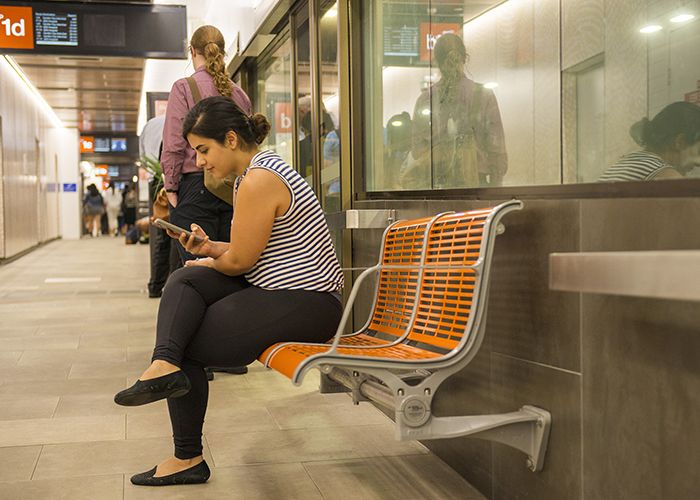 TransLink's bright orange Concourse Seats add warmth and comfort to the refurbished station.