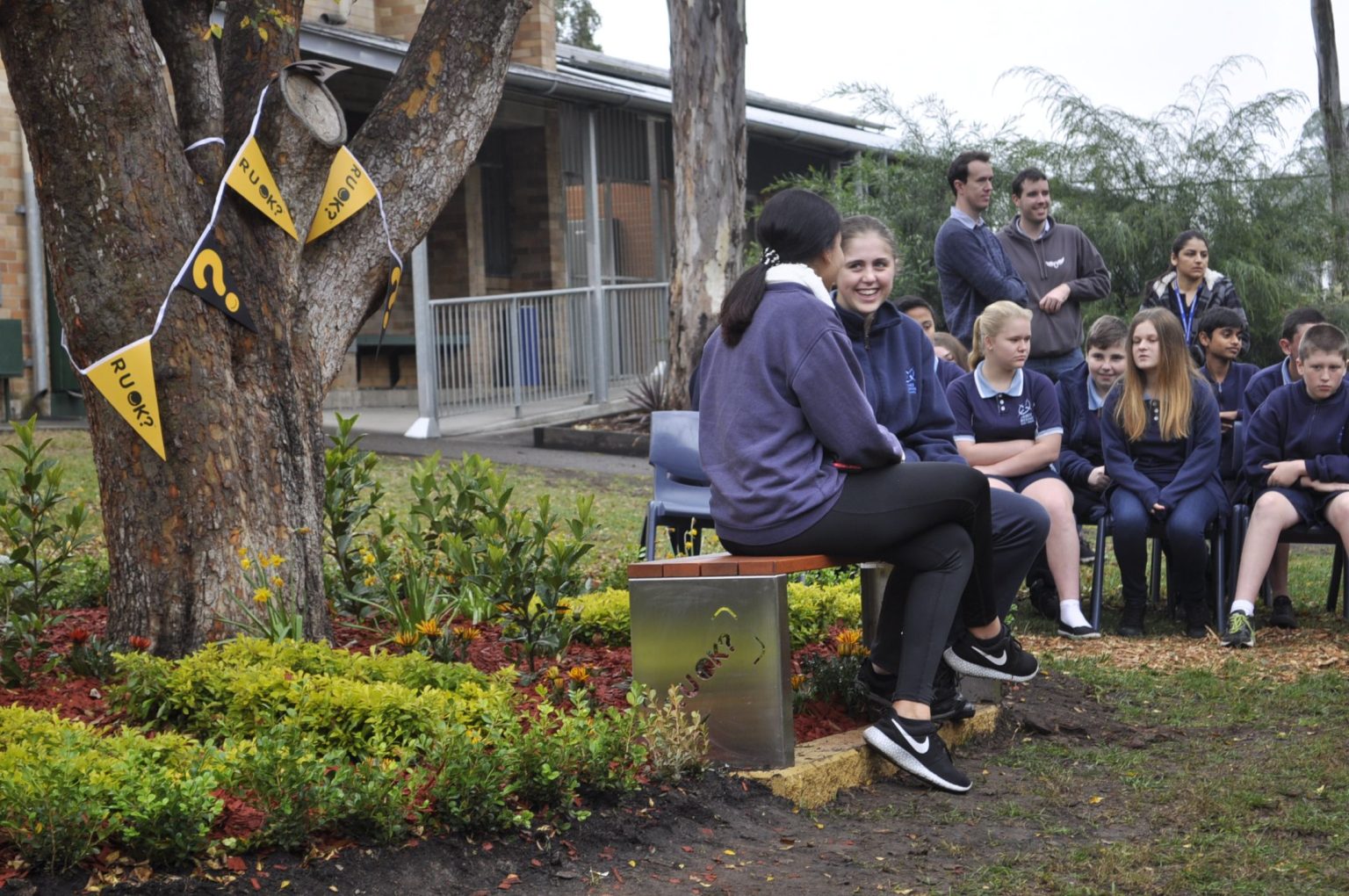 Students enjoying a chat on the R U OK? Bench.