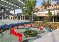 Tailored circular bench in Lobster Red for the upgraded Randwick Public School campus.