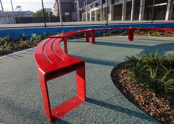 Tailored circular bench in Lobster Red for the upgraded Randwick Public School campus.