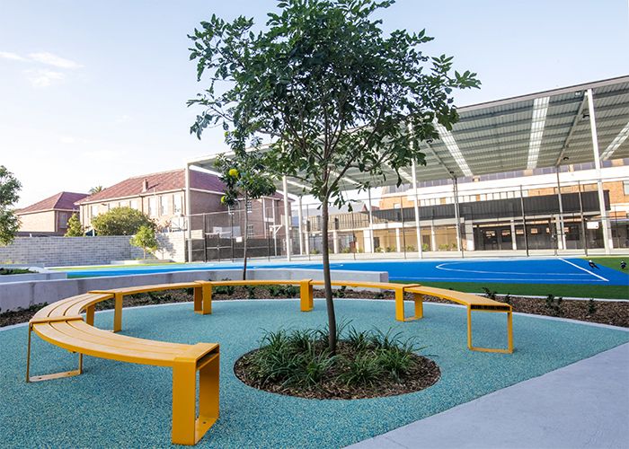 Tailored circular bench in Safety Yellow for the upgraded Randwick Public School campus.