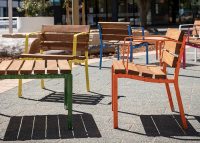 Forum Seats and Low Table, frames in Shamrock Green, Brilliant Yellow, Sensation Orange, Bondi Blue.