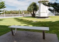 Custom Bench designed by Urbis, with anodised aluminium battens and stainless steel frame.