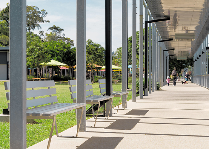 Custom Seat designed by Urbis, with anodised aluminium battens and stainless steel frame.
