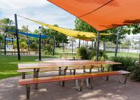 Custom Picnic Setting designed by Urbis, in Lobster Red, Sensation Orange, Safety Yellow and Brilliant Yellow.