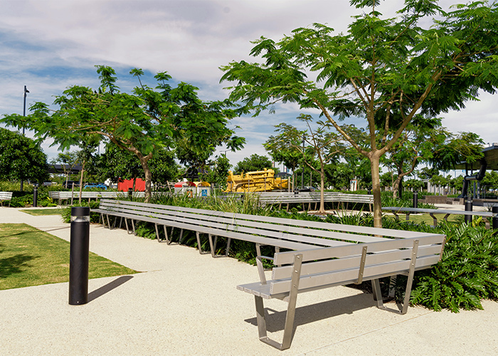 Custom Seat designed by Urbis, with anodised aluminium battens and stainless steel frame.