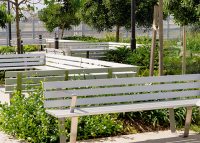 Custom Seat designed by Urbis, with anodised aluminium battens and stainless steel frame.