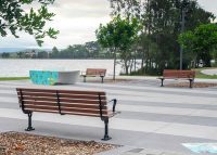 Mall Seat with battens in woodgrain aluminium Bush Cherry, angle arms and frame in Night Sky.