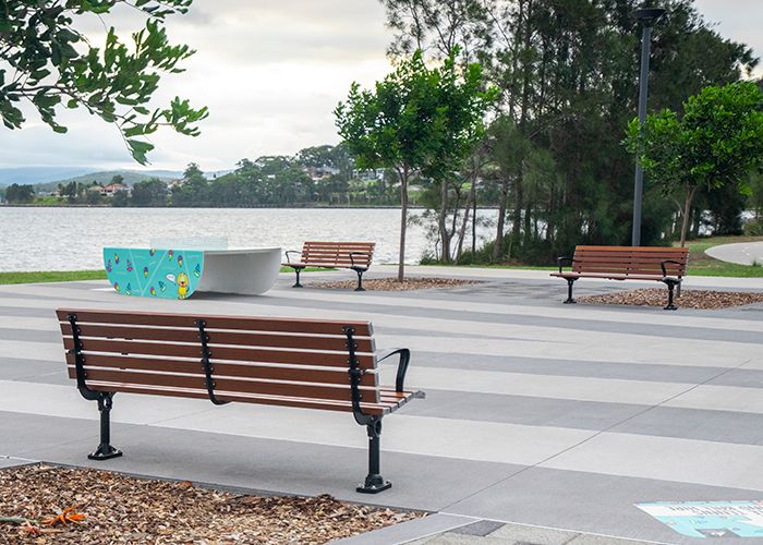 Mall Seat with battens in woodgrain aluminium Bush Cherry, angle arms and frame in Night Sky.