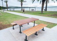 Mall Table with battens in woodgrain aluminium Bush Cherry, Mall Slim Benches with tailored woodgrain battens.