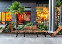 Tailored Linea VT seating system with Spotted Gum hardwood battens, Textura Dark Bronze frame.