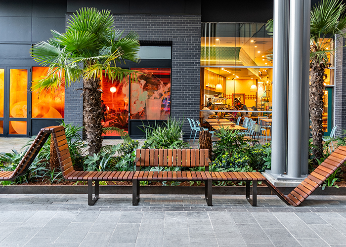 Tailored Linea VT seating system with Spotted Gum hardwood battens, Textura Dark Bronze frame.