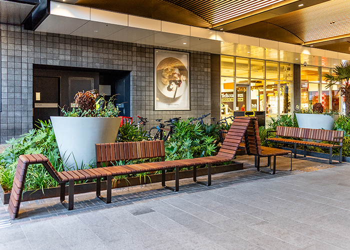 Tailored Linea VT seating system with Spotted Gum hardwood battens, Textura Dark Bronze frame.