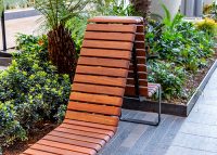 Tailored Linea VT seating system with Spotted Gum hardwood battens, Textura Dark Bronze frame.