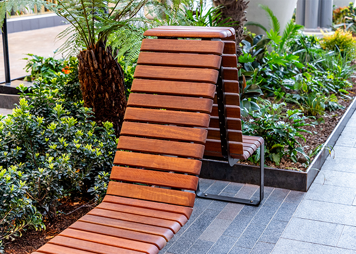 Tailored Linea VT seating system with Spotted Gum hardwood battens, Textura Dark Bronze frame.
