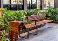 Tailored Linea VT seating system with Spotted Gum hardwood battens, Textura Dark Bronze frame.
