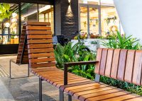 Tailored Linea VT seating system with Spotted Gum hardwood battens, Textura Dark Bronze frame.