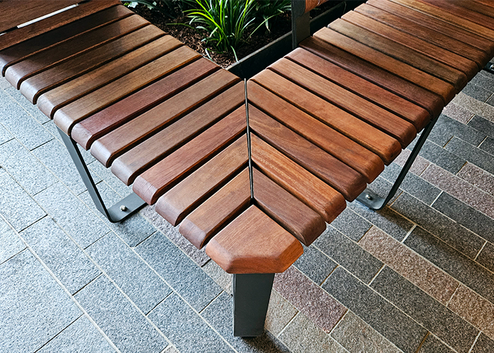 Tailored Linea VT bench with Spotted Gum hardwood battens, Textura Dark Bronze frame.