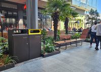 Escola Bin Enclosure (WBE-E120) dual unit in Textura Dark bronze with etched signage, Brilliant Yellow insert.