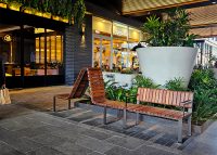 Tailored Linea VT seating system with Spotted Gum hardwood battens, Textura Dark Bronze frame.