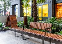 Tailored Linea VT seating system with Spotted Gum hardwood battens, Textura Dark Bronze frame.