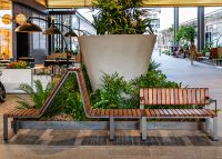 Tailored Linea VT seating system with Spotted Gum hardwood battens, Textura Dark Bronze frame.