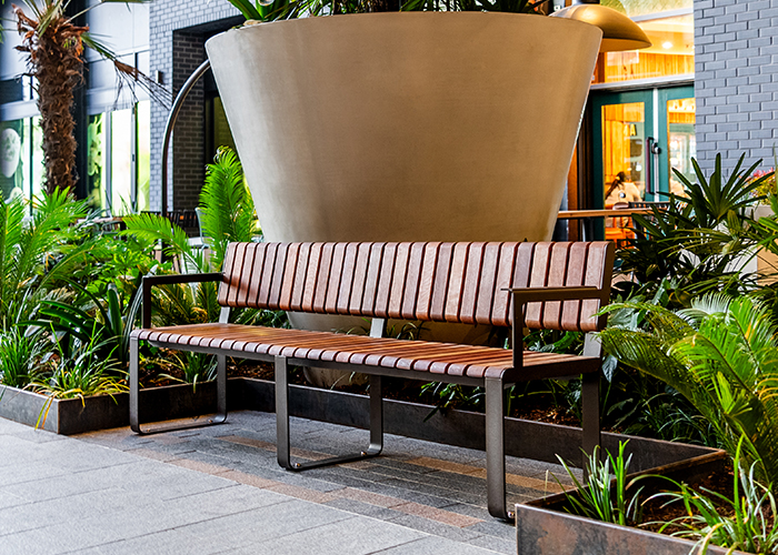 Tailored Linea VT seating system with Spotted Gum hardwood battens, Textura Dark Bronze frame.
