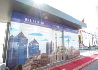 Official opening of the first 28 bus shelters in Sharjah, with red carpet.