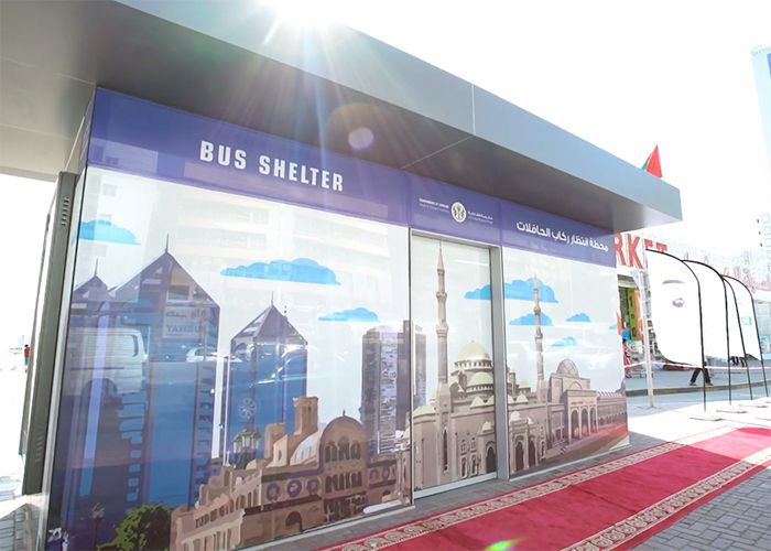 Official opening of the first 28 bus shelters in Sharjah, with red carpet.