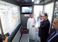 Officials survey the new bus shelters.