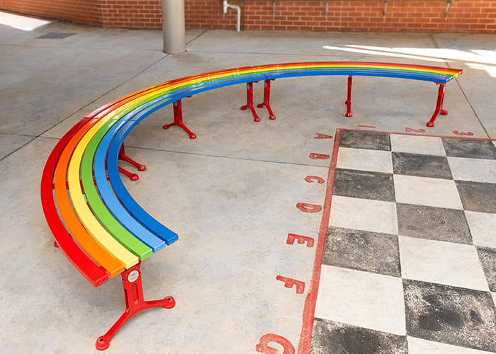 Mall Curved Slim Benches in DuraBright Lobster Red, Orange, Yellow, Viper Green, Bondi Blue and Jaybird.