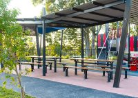 Park DDA Setting, battens in aluminium woodgrain Spotted Gum, frames in Monument.