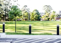 Wide Bollards, dome head with single collar, subsurface fixed and removable, with bodies in Monument.