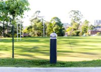 Wide Bollard, dome head with single collar, powdercoated in Monument.
