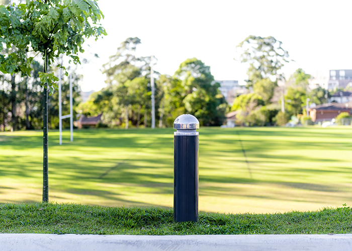 Wide Bollard, dome head with single collar, powdercoated in Monument.