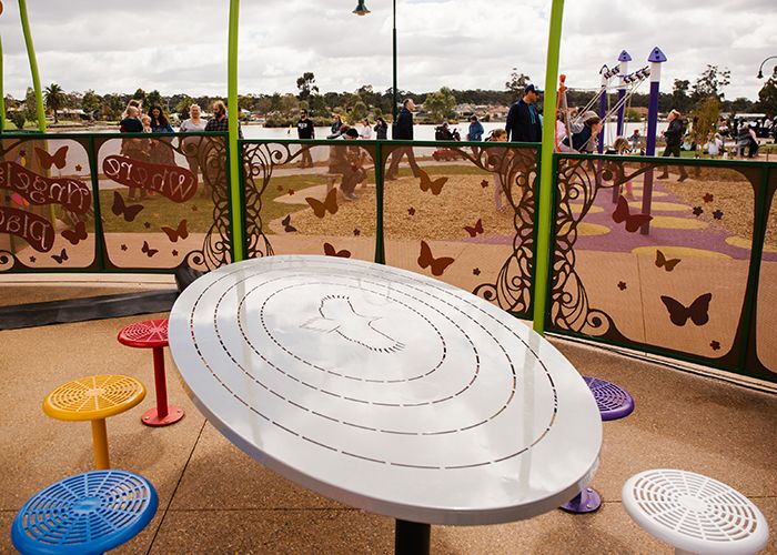 In the 'Where Angels Play' junior area, custom oval tables paired with Cafe Stools.