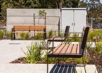 Linea Seat (LIS10, 1800mm) with aluminium woodgrain Spotted Gum battens, Textura Dark Bronze frame.
