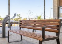 Linea Seat (LIS10, 1800mm) with aluminium woodgrain Spotted Gum battens, Textura Dark Bronze frame.