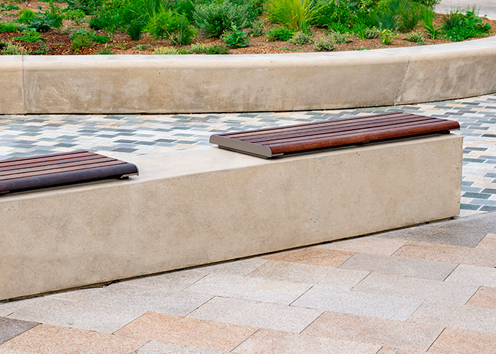 Linea Benches (LIB6, 1200mm) plinth-fixed with hardwood battens, Jasper frames.