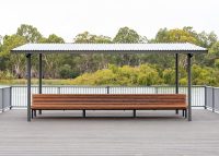 Classic Plaza Back-to-Back Seat with aluminium woodgrain battens in Spotted Gum, Sable Bass frame.